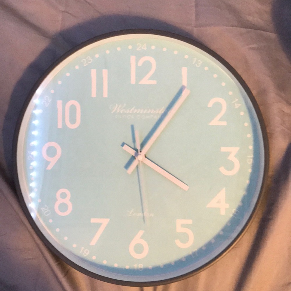 Light blue clock that is brand new:)